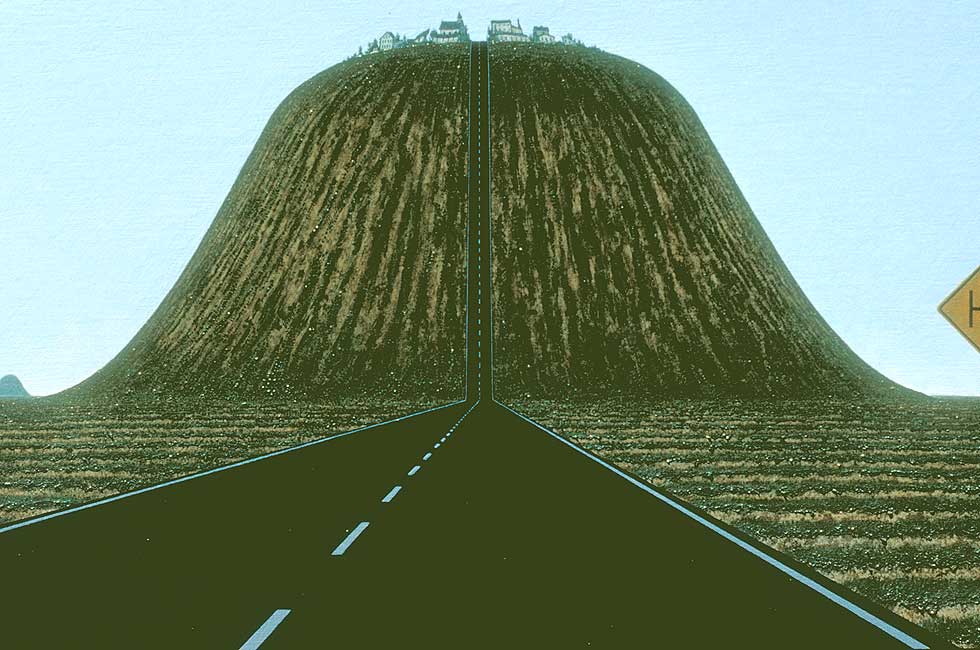 View from the driver's seat of a car, showing a bodacious hill ahead-- here focusing on the hill