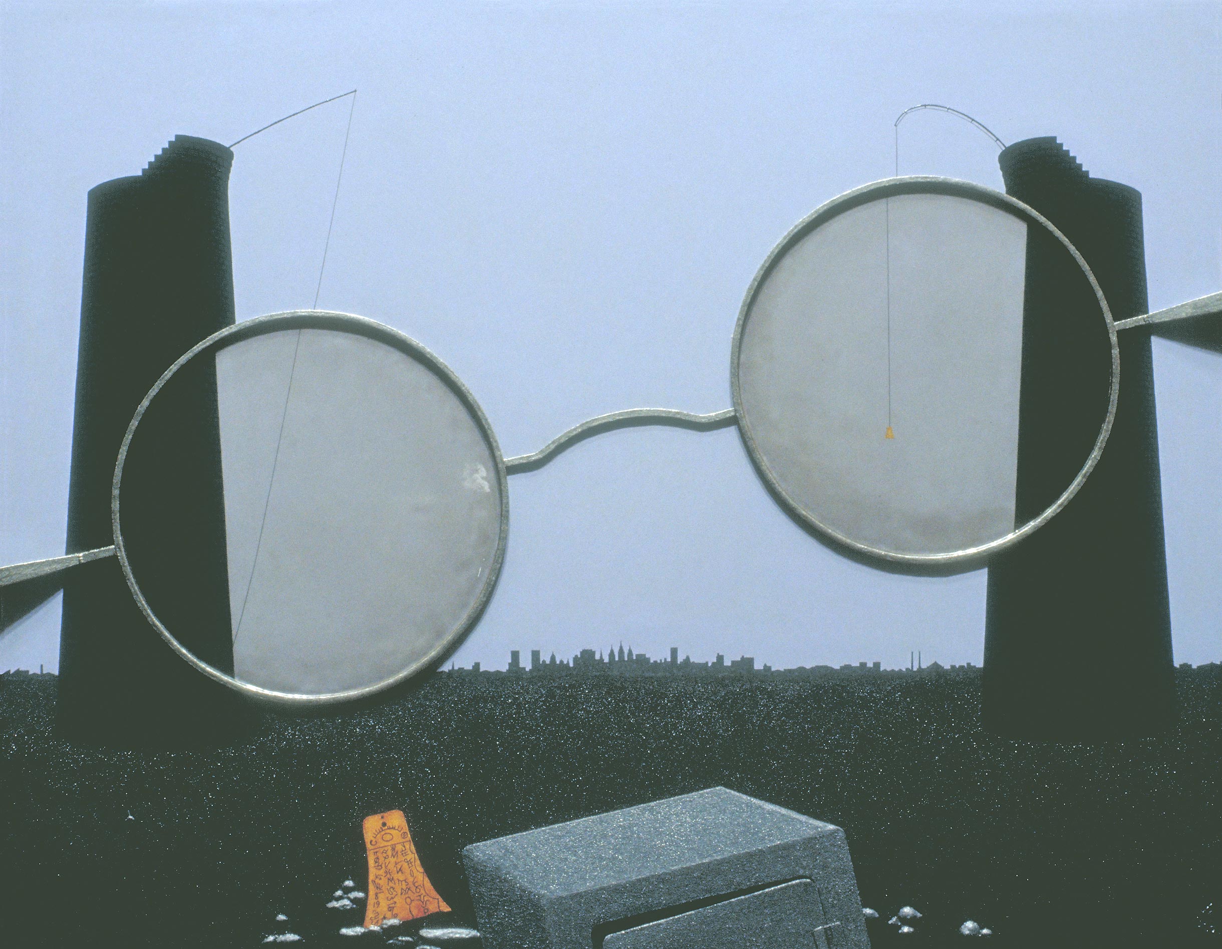 Two towers behind a giant pair of silver spectacles, a city in the distance