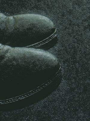 Detail of a search for earthworms by vibration of an implanted spade, here focusing on the shoes of the person with the spade.